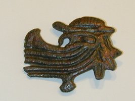 Viking brooch hidden face of Odin