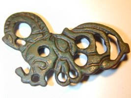 Viking brooch with hidden face motifs